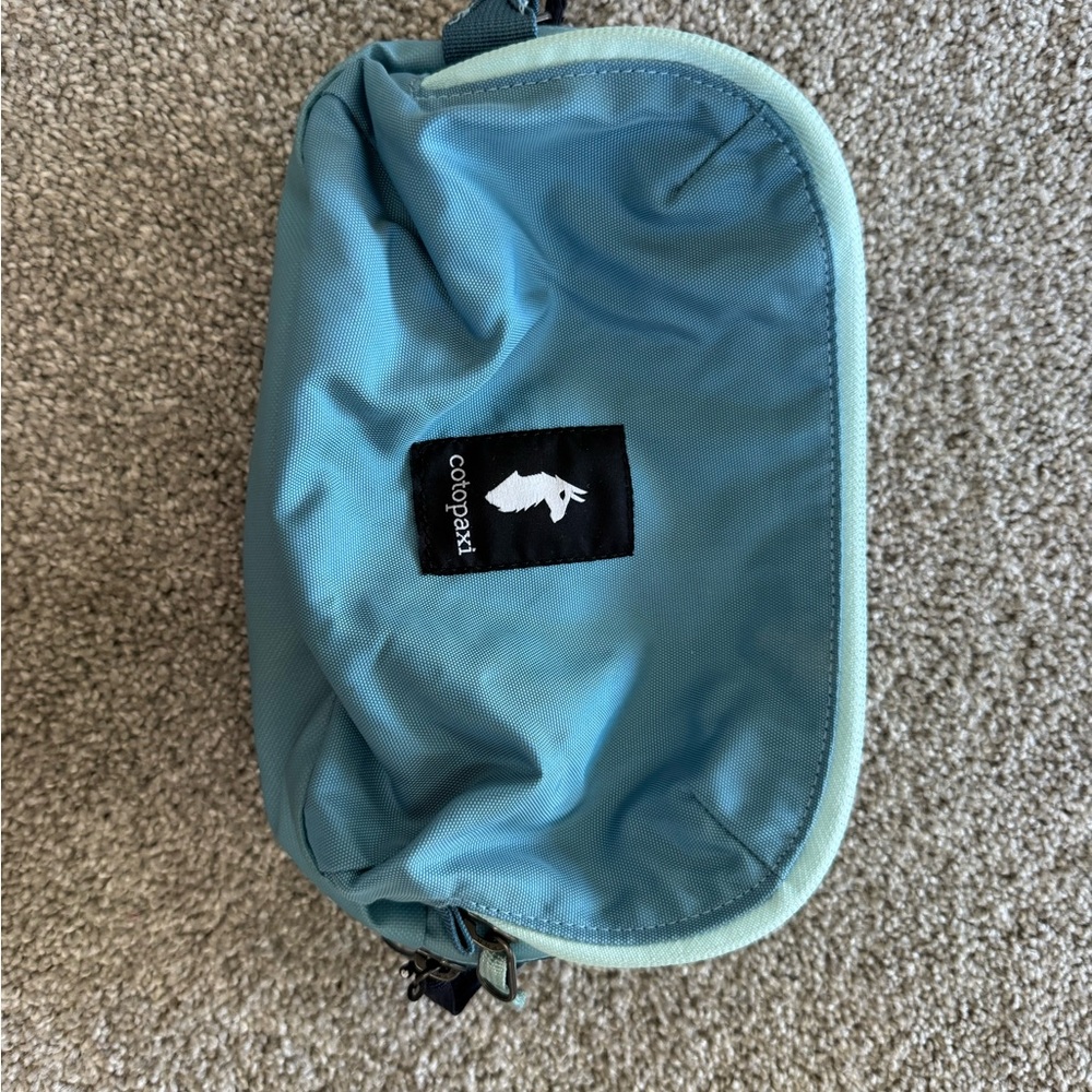 Cotopaxi blue makeup bag